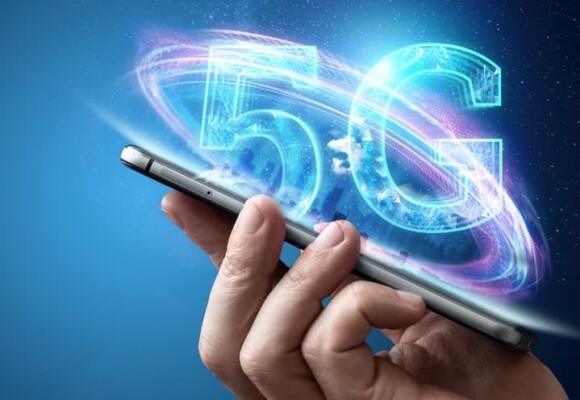 Person holding mobile phone with a 5G logo
