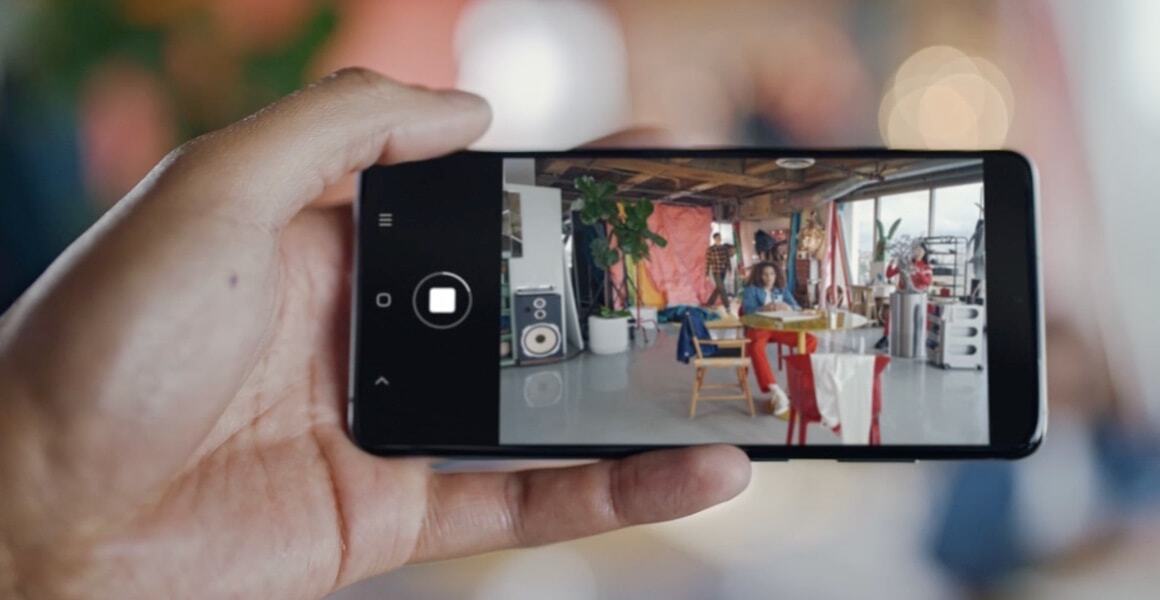 person taking multiple photos on Galaxy S20