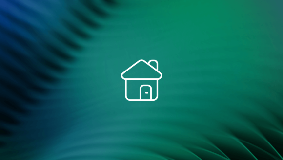 white icon of a home in front of green leaf background