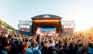 People enjoying live concert in the daylight