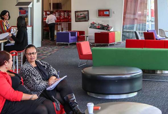 Vodafone employees talking on a couch