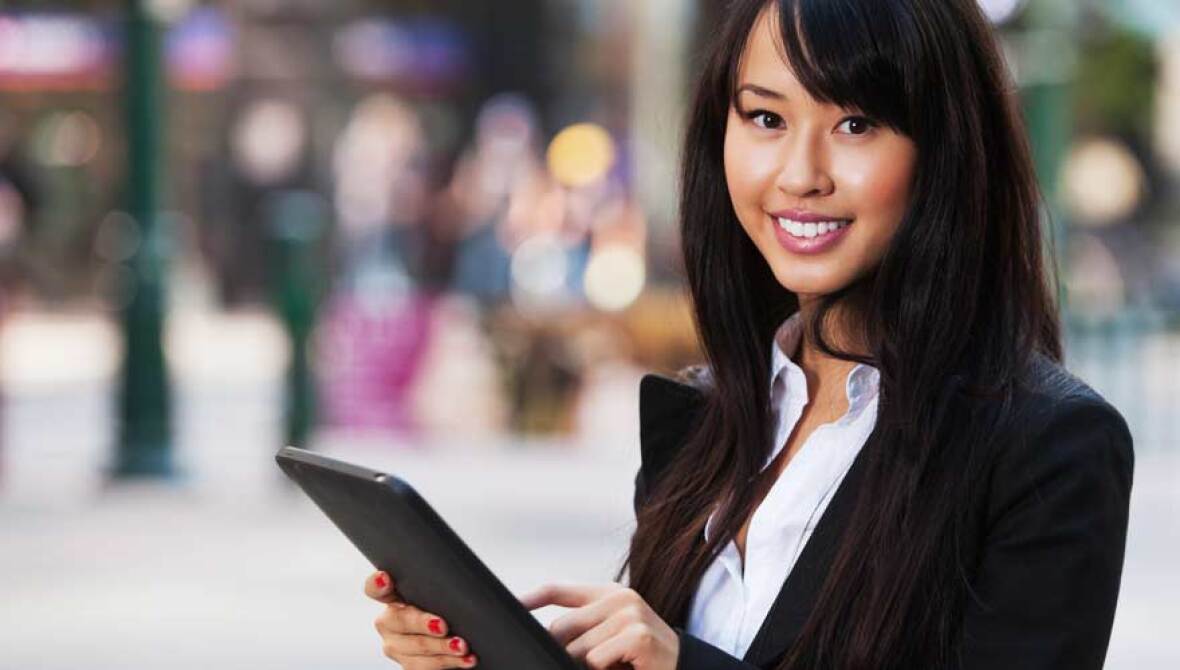 A woman holding a tablet