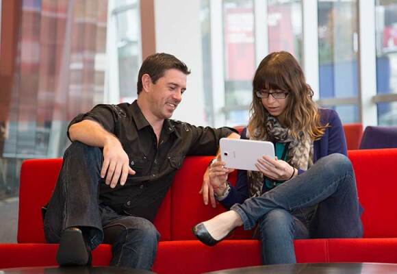 Vodafone employees sitting down and talking