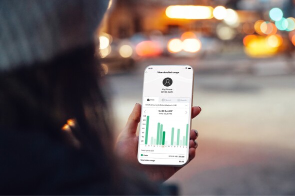 Woman on phone looking at their data plan