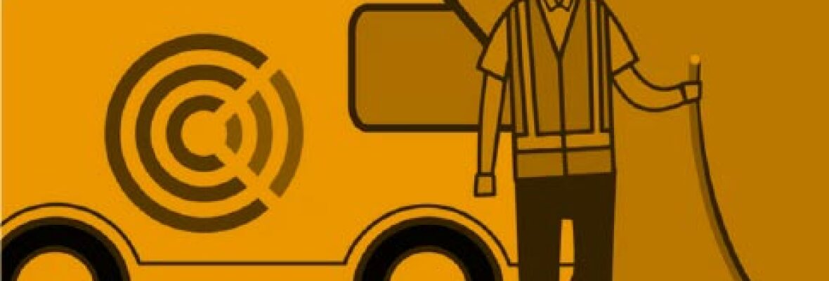 man with a wire standing in front of a van
