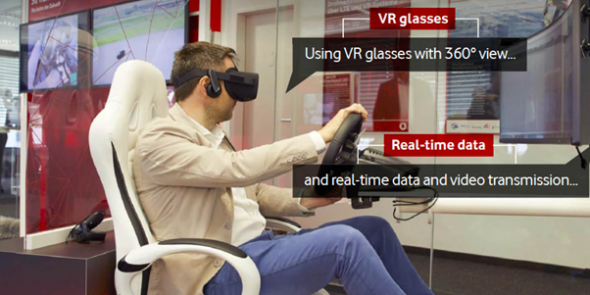 Man wearing VR glasses holding steering wheel and playing game