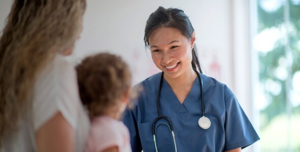 Doctor checking on toddler at a medical clinic