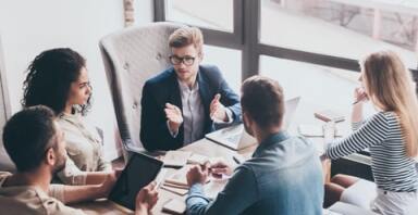 People in a group discussion in office