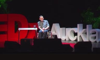 Philip Patston onstage speaking at TedX Auckland.