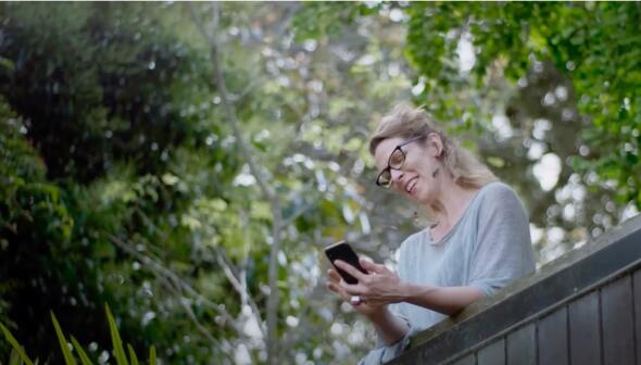 Image of person checking phone