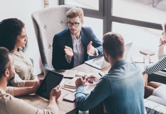 People in a group discussion in an office