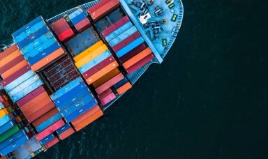 Photo of a ship with lot of containers