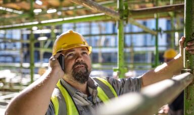 Construction worker on mobile call