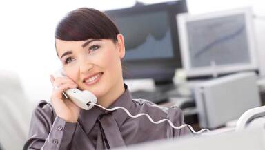 Lady talking on the phone in an office