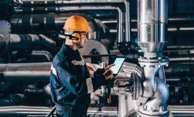 Worker in a factory using a tablet