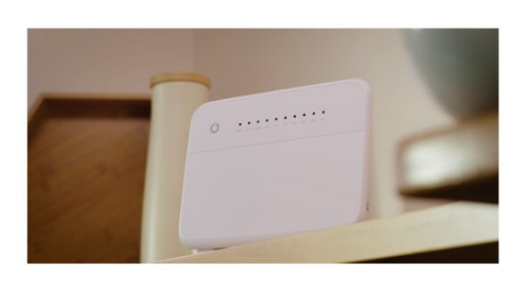 white modem kept on a shelf