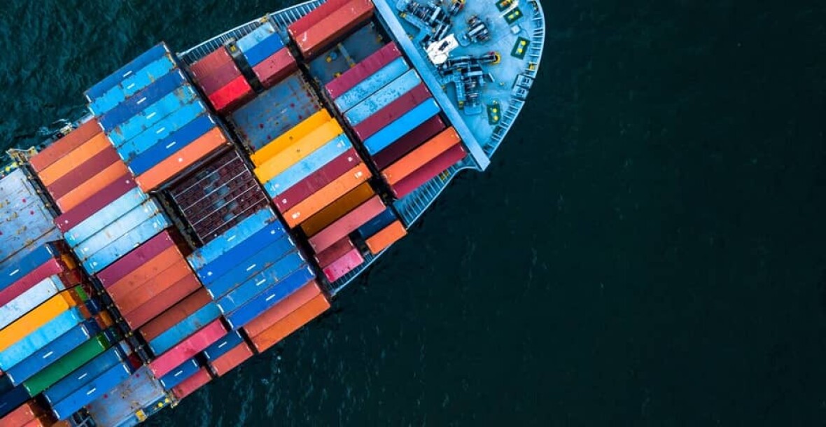 Photo of a ship with lot of containers
