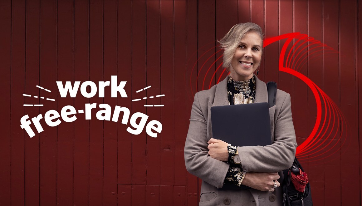 Work Free Range. Woman holding a laptop