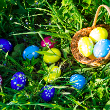 easter basket on grass with easter eggs