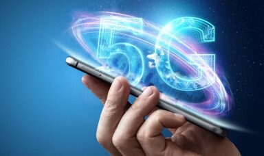 Person holding mobile phone with a 5G logo