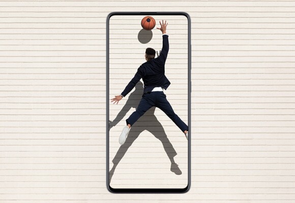 Man playing basketball shown inside a mobile phone