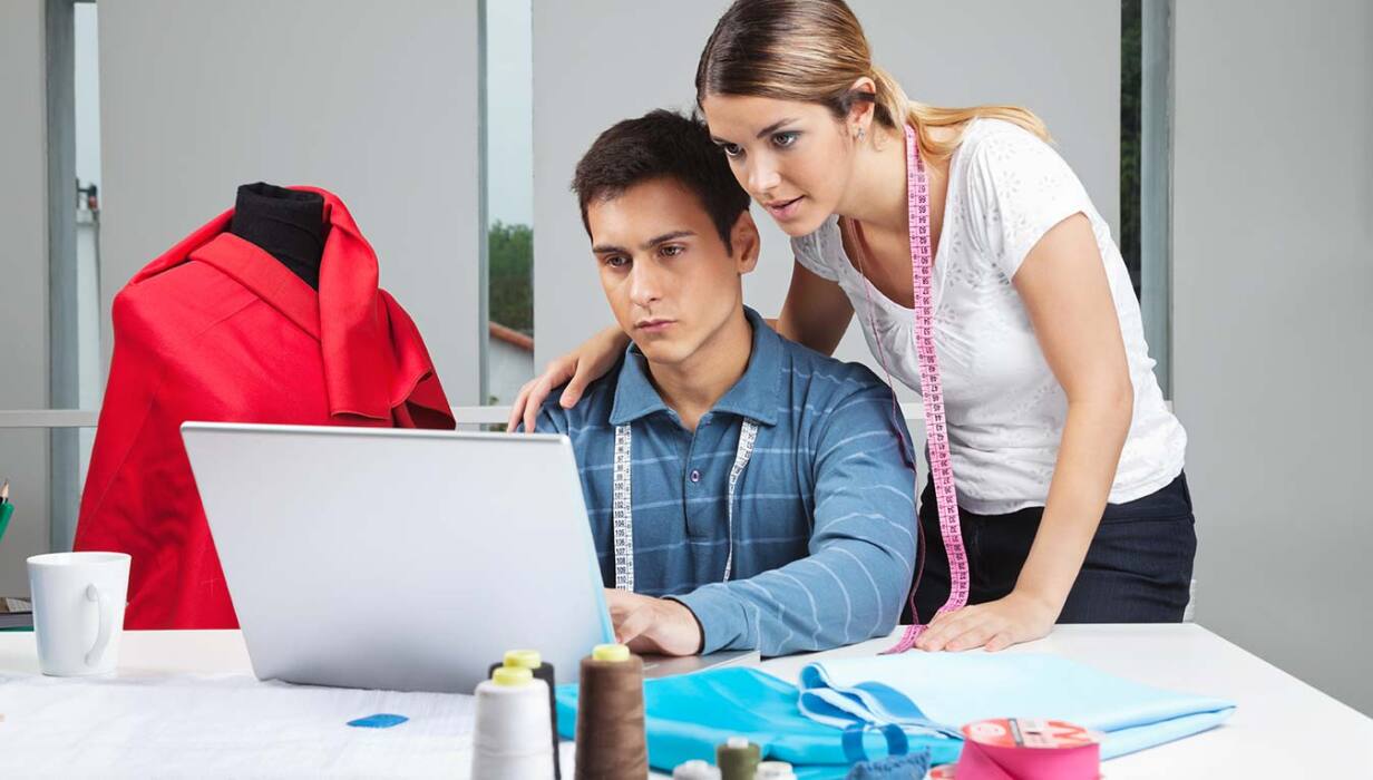 Man and woman working at a clothing store