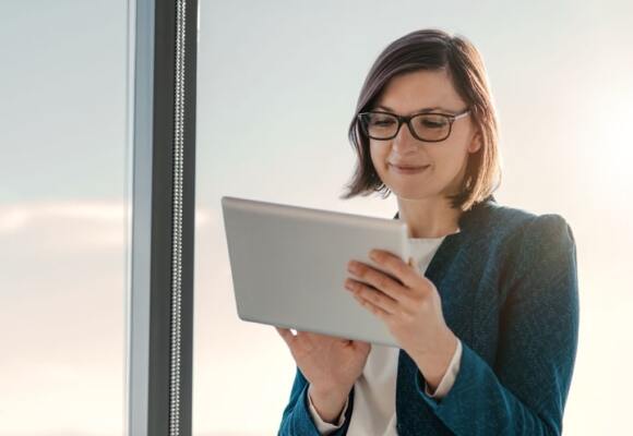 Lady looking at a tablet