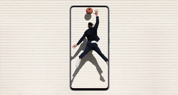 Man playing basketball shown inside a mobile phone