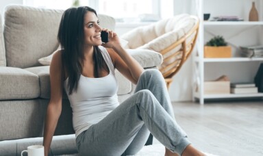 Person sitting and talking on the phone