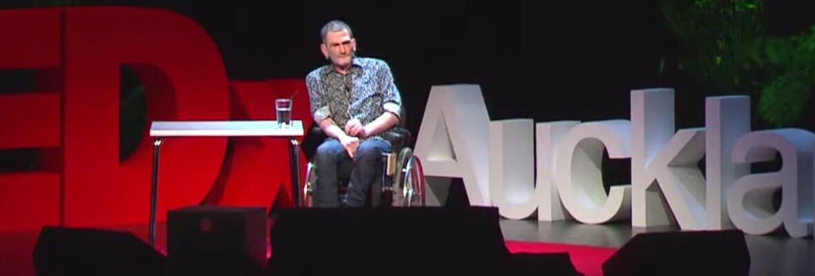 Philip Patston onstage speaking at TedX Auckland.
