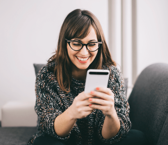 Smiling lady, using her new eSIM setup.