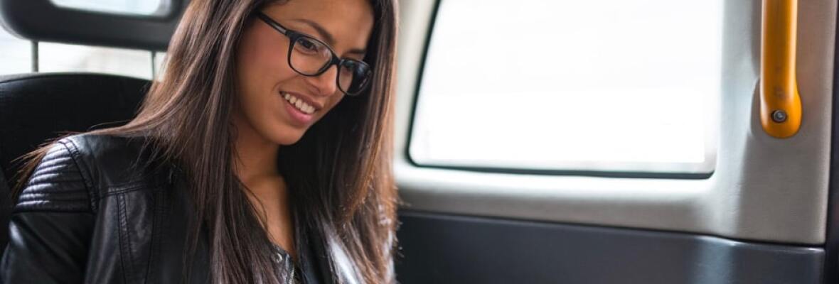 Lady looking at a tablet in a car
