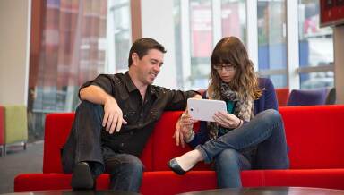 Vodafone employees sitting down and talking