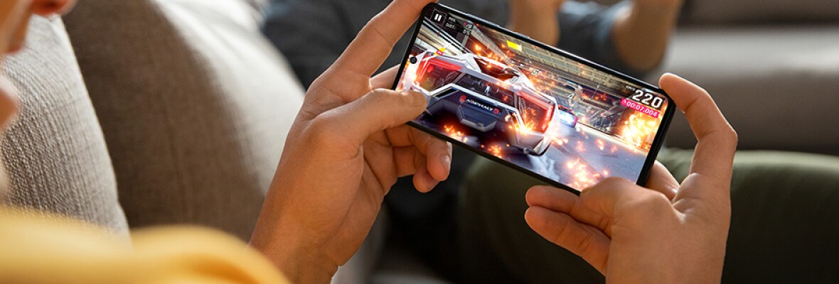 Man playing game on his mobile phone