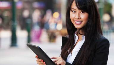 A woman holding a tablet