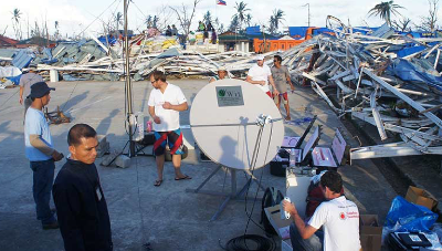 Group of people around satellite dish