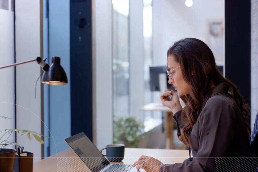 Woman sitting at her desk in the office