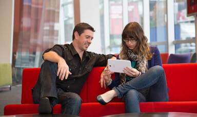 Vodafone employees sitting down and talking