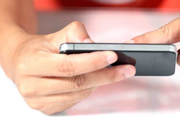 A closeup of someone's hands holding a smartphone