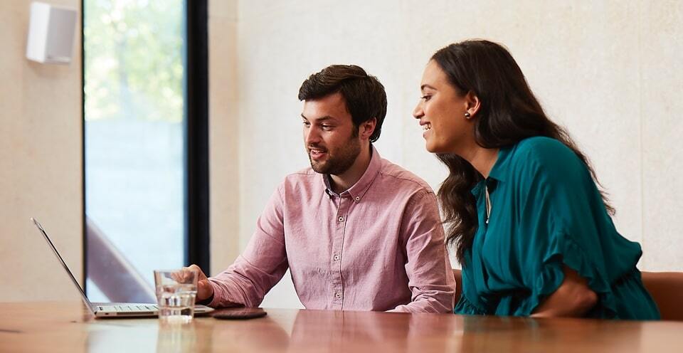 Man and woman looking at a laptop