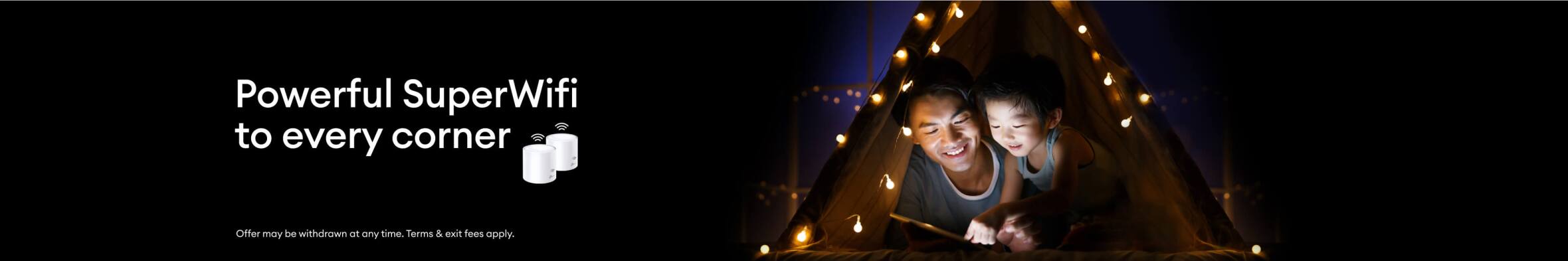 Young dad and son playing a game on a tablet, using SuperWifi.