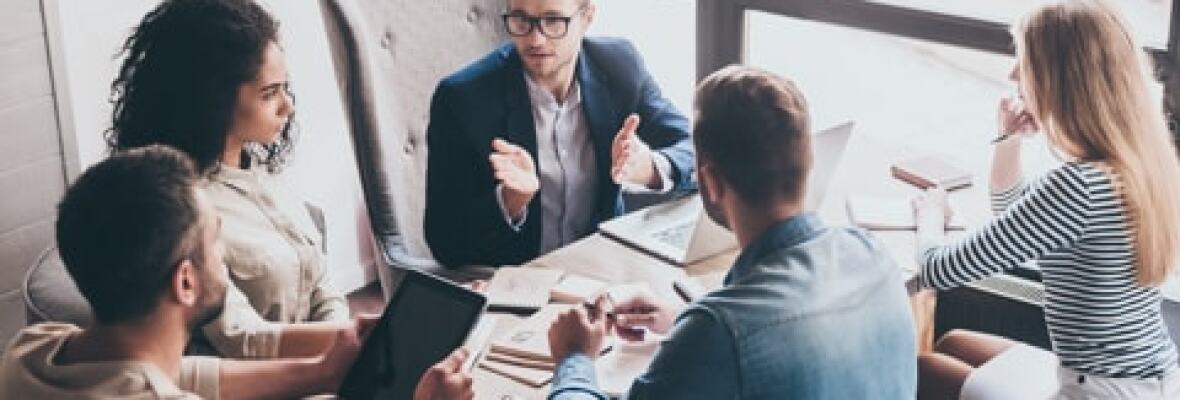 People in a group discussion in an office