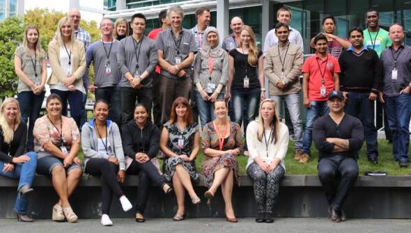 A group of Vodafone employees posing together on their first day