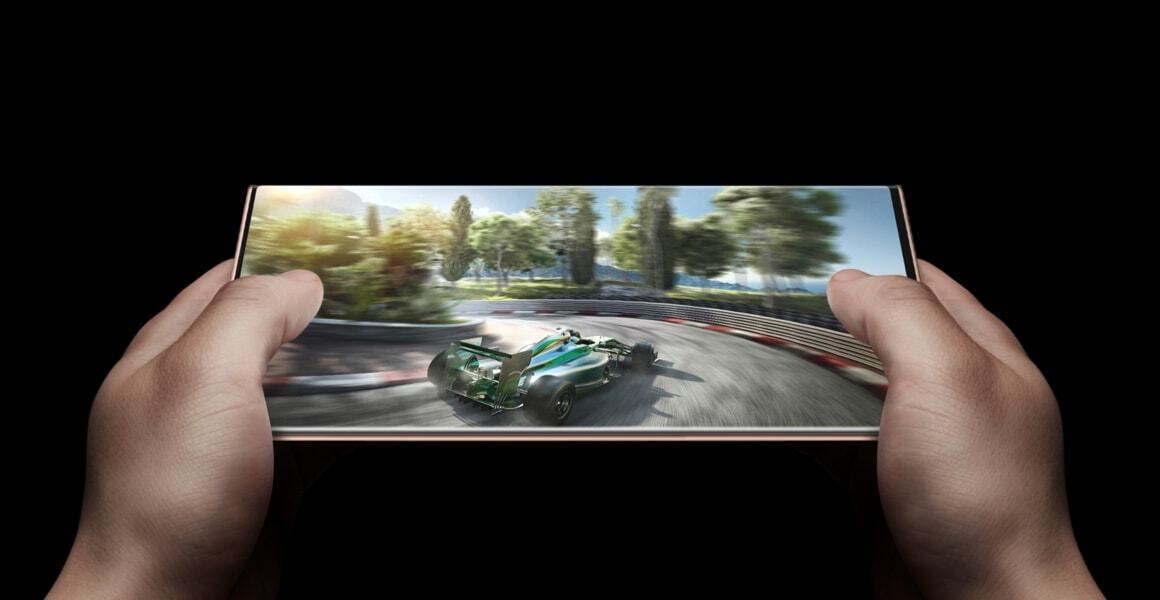 Person playing racing car game on the Note20