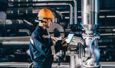 Worker in a factory using a tablet