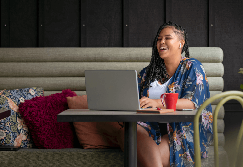 Woman working remotely in a cafe
