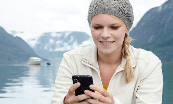 A woman looking at her mobile phone