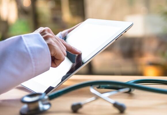 Doctor working on a tablet