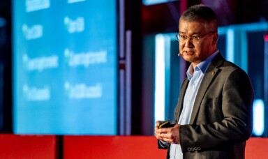 Dr Swee Tan speaking onstage at Tedx Aucklamd.