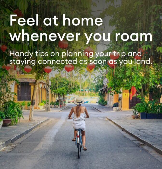 A lady, biking cobbled tropical streets, while roaming.